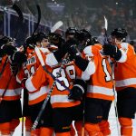 
              Philadelphia Flyers' Cam Atkinson (89) celebrates with teammates after scoring the game-winning goal during overtime in an NHL hockey game against the Calgary Flames, Tuesday, Nov. 16, 2021, in Philadelphia. (AP Photo/Matt Slocum)
            