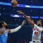 
              Detroit Pistons forawrd Saddiq Bey (41) shoots over Los Angeles Clippers forward Paul George (13) during the first half of an NBA basketball game, Friday, Nov. 26, 2021, in Los Angeles. (AP Photo/Ringo H.W. Chiu)
            