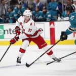 
              Carolina Hurricanes right wing Andrei Svechnikov (37) controls the puck in front of San Jose Sharks defenseman Jacob Middleton (21) during the second period of an NHL hockey game Monday, Nov. 22, 2021, in San Jose, Calif. (AP Photo/Josie Lepe)
            