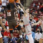 
              Bowling Green's Samari Curtis, left, shoots over Ohio State's Jimmy Sotos during the second half of an NCAA college basketball game Monday, Nov. 15, 2021, in Columbus, Ohio. (AP Photo/Jay LaPrete)
            