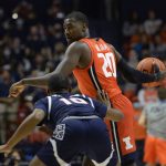 
              Illinois' Da'Monte Williams (20) holds the ball away from Jackson State's Dyllan Taylor during the first half of an NCAA college basketball game Tuesday, Nov. 9, 2021, in Champaign, Ill. (AP Photo/Michael Allio)
            
