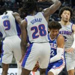 
              Philadelphia 76ers guard Matisse Thybulle (22) is surrounded by Detroit Pistons forward Jerami Grant (9), center Isaiah Stewart (28) and guard Cade Cunningham (2) during the second half of an NBA basketball game, Thursday, Nov. 4, 2021, in Detroit. (AP Photo/Carlos Osorio)
            