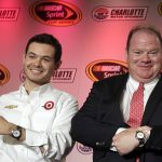 
              FILE - NASCAR driver Kyle Larson, left, and team owner Chip Ganassi show their Rolex watches for winning the Rolex 24 auto race during the NASCAR Charlotte Motor Speedway media tour in Charlotte, N.C., Thursday, Jan. 29, 2015. Chip Ganassi will “absolutely, 100%” be rooting for Kyle Larson to win the NASCAR championship in Sunday's, Nov. 7, 2021, finale. What an ironic ending that would be, though, for Larson to win his first championship on Ganassi's final day in NASCAR. Ganassi plucked Larson out of sprint car racing, developed him over nearly eight seasons and then, in Larson's free agency year, was forced to fire him in early 2020 over Larson's use of a racial slur. (AP Photo/Chuck Burton, File)
            