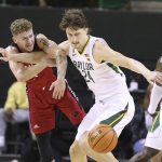 
              Baylor guard Matthew Mayer (24) steals the ball from Incarnate Word guard Drew Lutz (3) in the first half of an NCAA college basketball game, Friday, Nov. 12, 2021, in Waco, Texas. (AP Photo/Jerry Larson)/Waco Tribune-Herald via AP)
            
