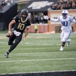 
              Wake Forest quarterback Sam Hartman (10) rushes for a touchdown during the first half of an NCAA college football game against Duke on Saturday, Oct. 30, 2021, in Winston-Salem, N.C. (AP Photo/Matt Kelley)
            