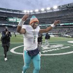 
              Miami Dolphins quarterback Tua Tagovailoa celebrates as he leaves the field after an NFL football game against the New York Jets, Sunday, Nov. 21, 2021, in East Rutherford, N.J. (AP Photo/Bill Kostroun)
            