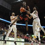 
              Oregon State forward Warith Alatishe grabs a rebound ahead of Iowa State guard Tyrese Hunter (11) during the second half of an NCAA college basketball game, Friday, Nov. 12, 2021, in Ames, Iowa. (AP Photo/Charlie Neibergall)
            