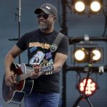 
              FILE - Singer Darius Rucker takes part in a concert before the NASCAR Daytona 500 auto race Sunday, Feb. 16, 2020, at Daytona International Speedway in Daytona Beach, Fla. While singer/songwriter Darius Rucker notes that pretty much all athletes “want to be singers and all singers want to be sports guys,” the biggest similarity is how they all need to mesh with teammates. Or bandmates. (AP Photo/Chris O'Meara, File)
            