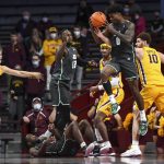 
              Jacksonville forward Rod Brown (0) pulls down an offensive rebound during the second half of the team's NCAA college basketball game against Minnesota on Wednesday, Nov. 24, 2021, in Minneapolis. (Aaron Lavinsky/Star Tribune via AP)
            
