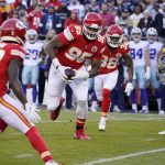 
              Kansas City Chiefs defensive tackle Chris Jones runs with the ball after recovering a fumble during the first half of an NFL football game against the Dallas Cowboys Sunday, Nov. 21, 2021, in Kansas City, Mo. (AP Photo/Ed Zurga)
            