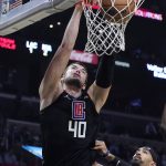 
              Los Angeles Clippers' Ivica Zubac (40) dunks over Miami Heat guard Gabe Vincent (2) during the second half of an NBA basketball game Thursday, Nov. 11, 2021, in Los Angeles. (AP Photo/Marcio Jose Sanchez)
            