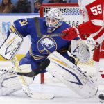 
              Buffalo Sabres goaltender Dustin Tokarski (31) looks for the puck in traffic during the second period of an NHL hockey game against the Detroit Red Wings, Saturday, Nov. 6, 2021, in Buffalo, N.Y. (AP Photo/Jeffrey T. Barnes)
            