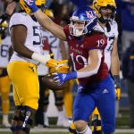 
              Kansas linebacker Gavin Potter (19) celebrates a fumble recovery against West Virginia during the first quarter of an NCAA college football game Saturday, Nov. 27, 2021, in Lawrence, Kan. (AP Photo/Ed Zurga)
            