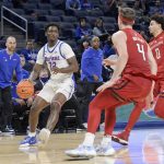 
              DePaul's David Jones (32) looks for an opening against Rutgers during the second half of an NCAA college basketball game Thursday, Nov. 18, 2021, in Chicago. (AP Photo/Mark Black)
            