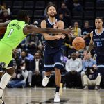 
              Memphis Grizzlies forward Kyle Anderson, center, passes the ball against Minnesota Timberwolves forward Anthony Edwards (1) in the second half of an NBA basketball game Monday, Nov. 8, 2021, in Memphis, Tenn. (AP Photo/Brandon Dill)
            