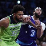 
              Los Angeles Lakers' Anthony Davis, right, and Minnesota Timberwolves' Karl-Anthony Towns fight for position during the first half of an NBA basketball game Friday, Nov. 12, 2021, in Los Angeles. (AP Photo/Jae C. Hong)
            