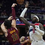 
              Washington Wizards' Montrezl Harrell (6) and Cleveland Cavaliers' Cedi Osman (16) battle for a rebound in the second half of an NBA basketball game, Wednesday, Nov. 10, 2021, in Cleveland. Washington won 97-94. (AP Photo/Tony Dejak)
            