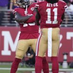 
              San Francisco 49ers wide receiver Deebo Samuel, left, celebrates after scoring a touchdown with wide receiver Brandon Aiyuk (11) during the second half of an NFL football game against the Minnesota Vikings in Santa Clara, Calif., Sunday, Nov. 28, 2021. (AP Photo/Tony Avelar)
            