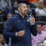 
              Michigan coach Juwan Howard watches from the sideline during the first half of the team's NCAA college basketball game against UNLV on Friday, Nov. 19, 2021, in Las Vegas. (AP Photo/David Becker)
            