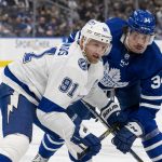 
              Tampa Bay Lightning's Steven Stamkos (91) and Toronto Maple Leafs' Auston Matthews (34) battle during a face-off during second-period NHL hockey game action in Toronto, Thursday, Nov. 4, 2021. (Frank Gunn/The Canadian Press via AP)
            