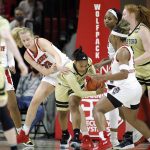 
              Wofford's Niyah Lutz grabs a rebound as North Carolina State's Elissa Cunane (33) reaches for it during the first half of an NCAA college basketball game Friday Nov. 12, 2021, in Raleigh, N.C. (AP Photo/Lynn Hey)
            