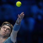 
              Russia's Andrey Rublev serves a ball to Serbia's Novak Djokovic during their ATP World Tour Finals singles tennis match, at the Pala Alpitour in Turin, Wednesday, Nov. 17, 2021. (AP Photo/Luca Bruno)
            