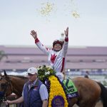 
              Mike Smith celebrates atop Corniche after winning the Breeders' Cup Juvenile race at the Del Mar racetrack in Del Mar, Calif., Friday, Nov. 5, 2021. (AP Photo/Jae C. Hong)
            