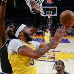 
              Los Angeles Lakers forward Anthony Davis (3) goes to basket under pressure from Sacramento Kings guard Terence Davis II (3) during the first half of an NBA basketball game in Los Angeles, Friday, Nov. 26, 2021. (AP Photo/Ringo H.W. Chiu)
            