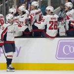 
              Washington Capitals left wing Conor Sheary (73) is congratulated by teammates after scoring against the San Jose Sharks during the first period of an NHL hockey game in San Jose, Calif., Saturday, Nov. 20, 2021. (AP Photo/Jeff Chiu)
            