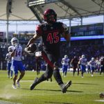 
              San Diego State wide receiver Jesse Matthews (45) runs to the end zone for a touchdown during the first half of an NCAA college football game against Boise State in Carson, Calif., Friday, Nov. 26, 2021. (AP Photo/Ashley Landis)
            