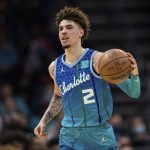 
              Charlotte Hornets guard LaMelo Ball (2) brings the ball up court against the New York Knicks during the first half of an NBA basketball game in Charlotte, N.C., Friday, Nov. 12, 2021. (AP Photo/Jacob Kupferman)
            