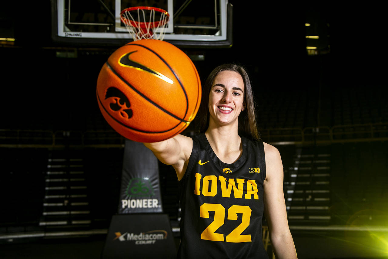 Iowa guard Caitlin Clark (22) poses for a photo during the Hawkeyes' NCAA college women's basketbal...