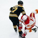 
              Boston Bruins' Jakub Zboril (67) checks Calgary Flames' Brad Richardson (15) during the first period of an NHL hockey game, Sunday, Nov. 21, 2021, in Boston. (AP Photo/Michael Dwyer)
            
