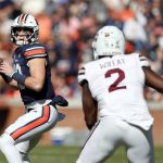 
              Auburn quarterback Bo Nix (10) throws a pass as Mississippi State linebacker Tyrus Wheat (2) brings pressure during the first half of an NCAA college football game Saturday, Nov. 13, 2021, in Auburn, Ala. (AP Photo/Butch Dill)
            