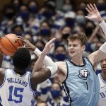 
              Citadel forward Stephen Clark (1) guards Duke center Mark Williams (15) during the first half of an NCAA college basketball game in Durham, N.C., Monday, Nov. 22, 2021. (AP Photo/Gerry Broome)
            