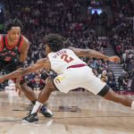 
              Toronto Raptors forward OG Anunoby (3) is defended by Cleveland Cavaliers guard Collin Sexton (2) during first-half NBA basketball game action in Toronto, Friday, Nov. 5, 2021. (Evan Buhler/The Canadian Press via AP)
            