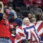 
              Arizona fans cheer on their team during an NCAA college basketball game against Michigan Sunday, Nov. 21, 2021, in Las Vegas. (AP Photo/Sam Morris)
            