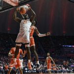 
              Illinois' Kofi Cockburn (21) dunks the ball during the first half of an NCAA college basketball game against Texas Rio Grande Valley Friday, Nov. 26, 2021, in Champaign, Ill. (AP Photo/Michael Allio)
            