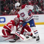 
              Detroit Red Wings goaltender Alex Nedeljkovic (39) stops a Montreal Canadiens right wing Josh Anderson (17) shot in the third period of an NHL hockey game Saturday, Nov. 13, 2021, in Detroit. (AP Photo/Paul Sancya)
            