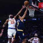 
              New York Knicks' Mitchell Robinson (23) blocks a shot by Indiana Pacers' Malcolm Brogdon (7) during the first half of an NBA basketball game Monday, Nov. 15, 2021, in New York. (AP Photo/Frank Franklin II)
            