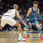 
              Charlotte Hornets guard LaMelo Ball (2) looks for an opening past New York Knicks guard Evan Fournier (13) during the first half of an NBA basketball game in Charlotte, N.C., Friday, Nov. 12, 2021. (AP Photo/Jacob Kupferman)
            