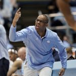 
              North Carolina head coach Hubert Davis directs his team during the second half of an NCAA college basketball game against Loyola Maryland in Chapel Hill, N.C., Tuesday, Nov. 9, 2021. (AP Photo/Gerry Broome)
            