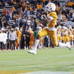 
              Tennessee running back Jaylen Wright (20) leaps into the end zone for a touchdown during the second half of an NCAA college football game against Vanderbilt, Saturday, Nov. 27, 2021, in Knoxville, Tenn. (AP Photo/Wade Payne)
            