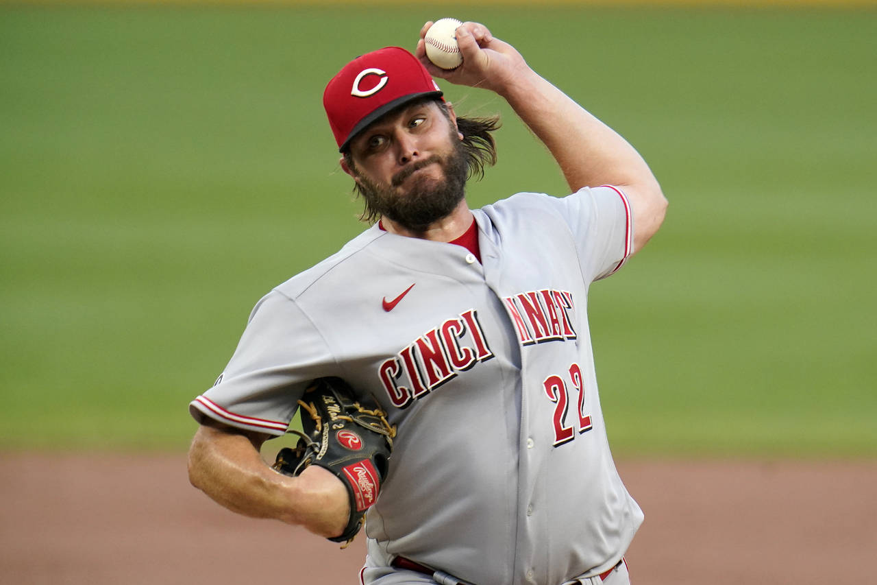 FILE - Cincinnati Reds starting pitcher Wade Miley delivers during the first inning of the team's b...