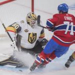 
              Montreal Canadiens' Jake Evans moves in against Vegas Golden Knights goaltender Robin Lehner during third-period NHL hockey game action in Montreal, Saturday, Nov. 6, 2021. (Graham Hughes/The Canadian Press via AP)
            