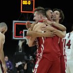 
              Wisconsin forward Carter Gilmore, back, guard Johnny Davis, middle, and forward Tyler Wahl celebrate after defeating St. Mary's 61-55 during an NCAA college basketball game at the Maui Invitational in Las Vegas, Wednesday, Nov. 24, 2021. (AP Photo/Rick Scuteri)
            