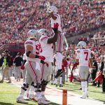 
              Ohio State's Thayer Munford, center, lifts Chris Olave, center right, after he scored a touchdown against Nebraska during the first half of an NCAA college football game Saturday, Nov. 6, 2021, at Memorial Stadium in Lincoln, Neb. Also on hand for the celebration were Kamryn Babb (8) and Luke Wypler (53). (AP Photo/Rebecca S. Gratz)
            