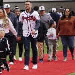 
              Atlanta Braves' Freddie Freeman, his wife Chelsea and son Charlie arrive during a celebration at Truist Park, Friday, Nov. 5, 2021, in Atlanta. The Braves beat the Houston Astros 7-0 in Game 6 on Tuesday to win their first World Series MLB baseball title in 26 years. (AP Photo/John Bazemore)
            