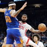 
              Houston Rockets guard D.J. Augustin, front right, passes the ball to a teammate as Phoenix Suns center JaVale McGee (00) defends during the first half of an NBA basketball game Thursday, Nov. 4, 2021, in Phoenix. (AP Photo/Ross D. Franklin)
            