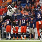 
              Southern Mississippi defensive back Eric Scott Jr. (12) intercepts a pass intended for UTSA wide receiver De'Corian Clark (88) during the first half of an NCAA college football game, Saturday, Nov. 13, 2021, in San Antonio. (AP Photo/Eric Gay)
            